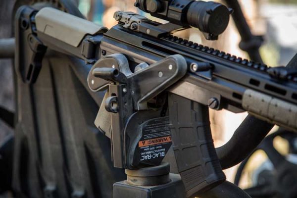 Blac-Rac 1070 Weapon Retention System holds an AK style rife installed in a UTV.