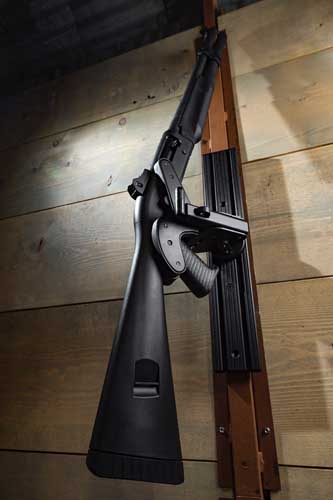 Pistol grip shotgun mounted on a Blac-Rac 1070 Weapon Retention System, wall mounted on an 18” T-channel. The weapons is angled to the left 45 degrees thanks to the flexible housing design.