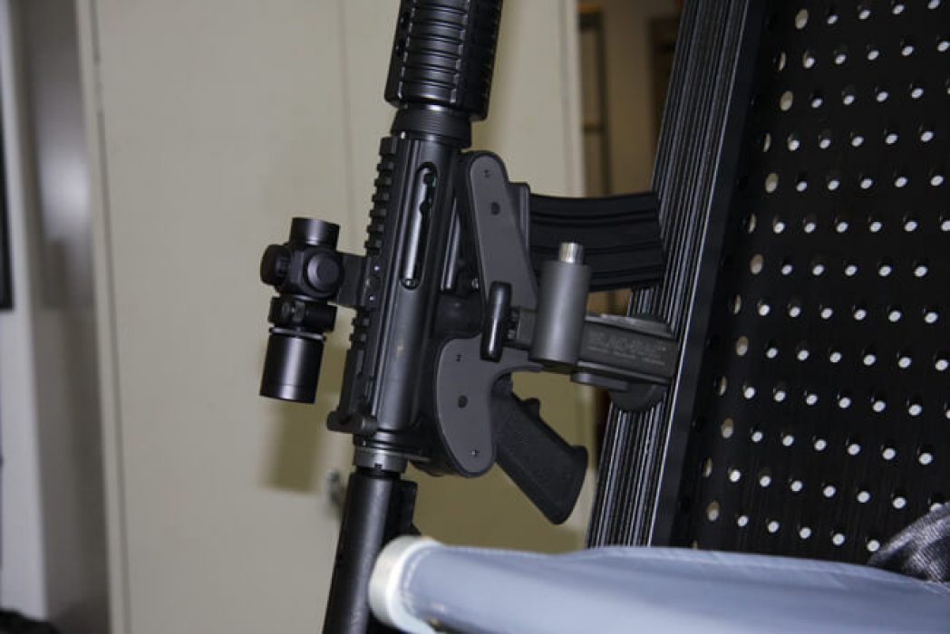 A replica M4 rifle is mounted in a Blac-Rac 1070. The rifle is mounted in a A-Star A350B3 helicopter.