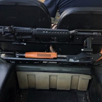 dual 1070 gun rack mounted in argo utility vehicle holding shotgun and ar15
