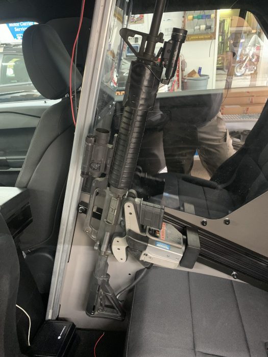 1082 gun rack mounted to partition holding ar15