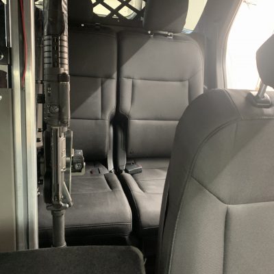 1082 gun rack mounted to partition holding ar15