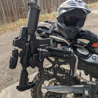 1070 gun rack mounted to bmw adventure motorcycle holding ar pistol