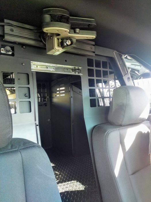 1082 gun rack mounted overhead with t-channel to k9 cage
